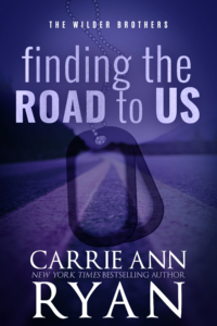 Finding the Road to us Purple Cover, dog tags in foreground.
